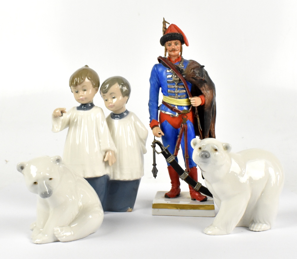 SITZENDORF; a French porcelain figure of a soldier, height 24cm, together with two Lladro figures of