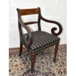 A Regency mahogany open sided elbow chair with wrythen column back and turned column feet.