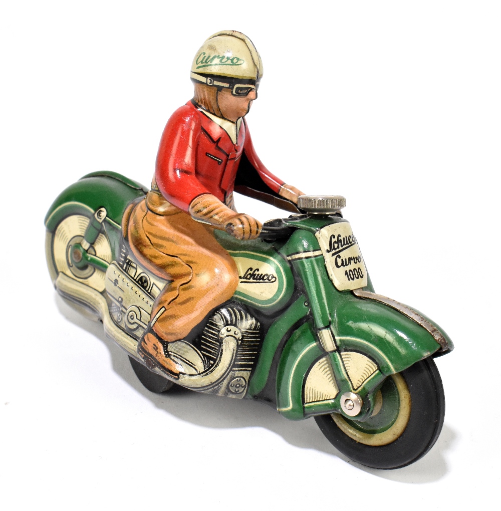 SCHUCO; a German tinplate clockwork Curvo 1000 motorcycle, with rider, length 12cm. PROVENANCE: