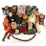 A vintage Punch and Judy carved and painted wood puppet set comprising Punch and Judy and Baby,