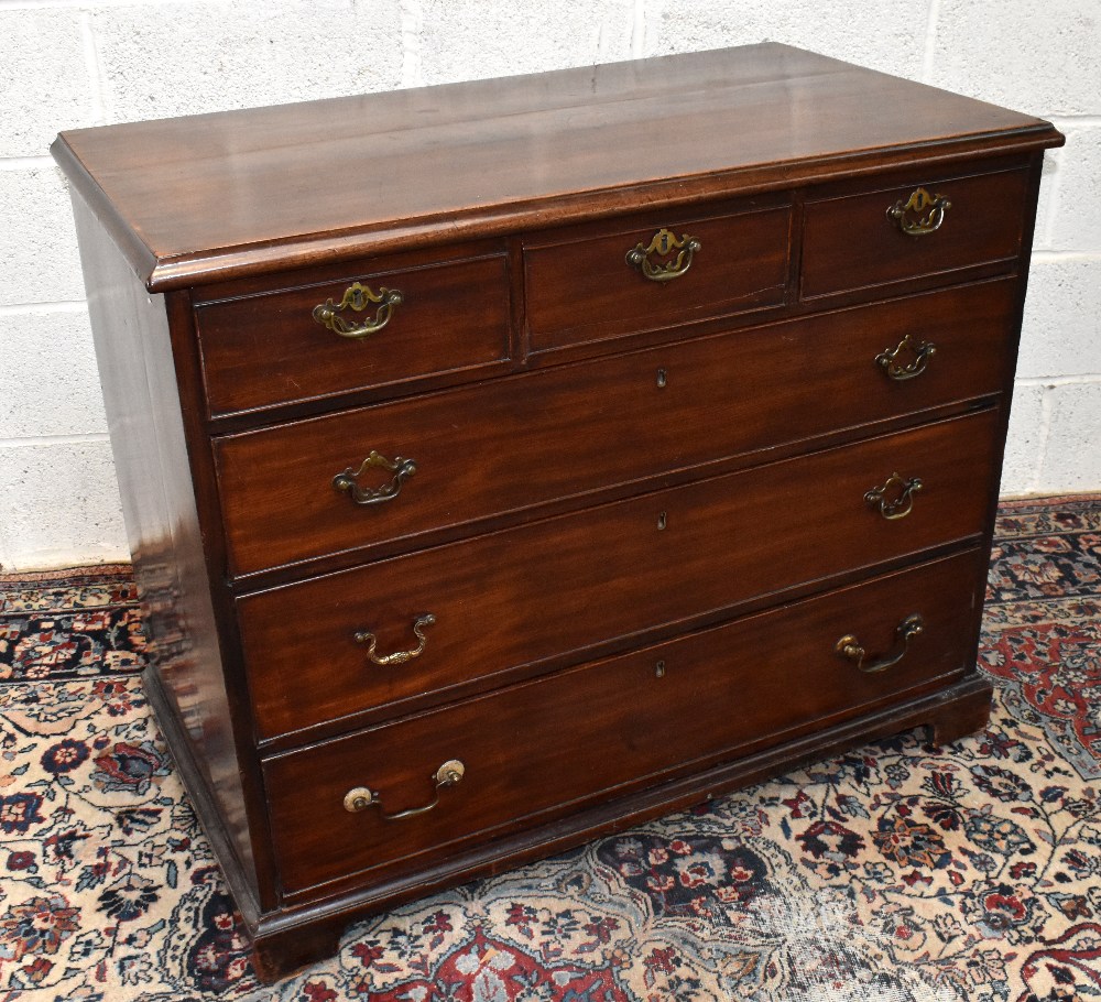 An early 19th century mahogany chest of three short and three long drawers on bracket feet, width