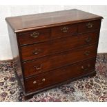 An early 19th century mahogany chest of three short and three long drawers on bracket feet, width