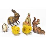 A collection of seven vintage clockwork toys comprising a German tinplate squirrel, an unmarked