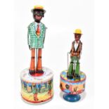 Two Japanese tinplate dancing figure toys, the smaller is a clockwork example and the larger an