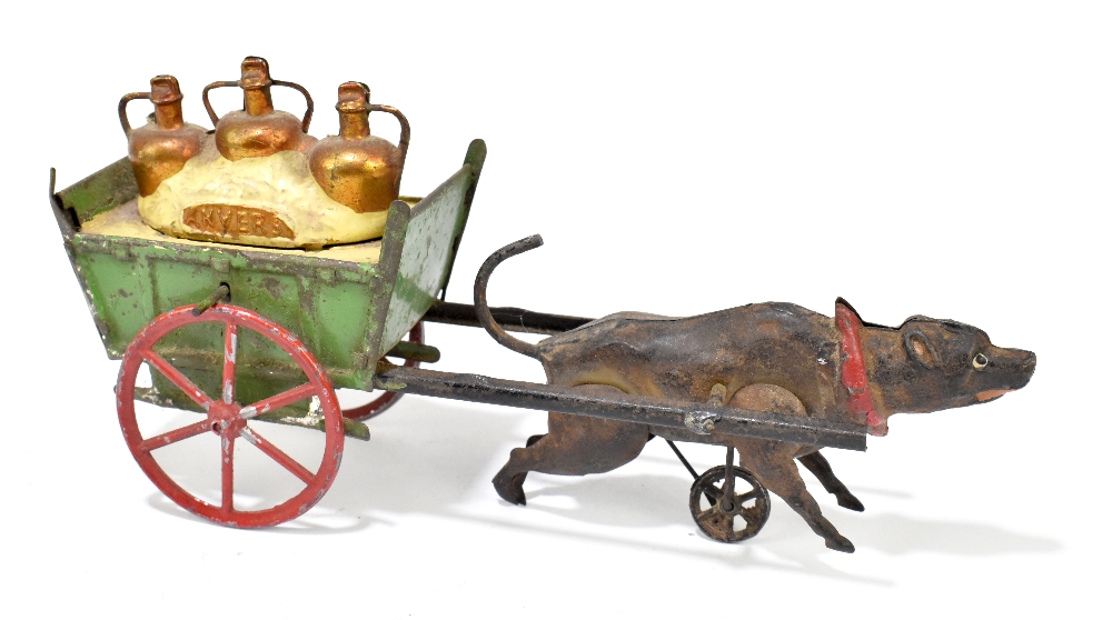 A 1920s tinplate toy modelled as a dog pulling a cart with three bottles titled 'Anvers', length