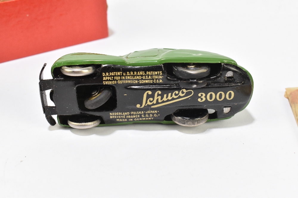 SCHUCO; a boxed tinplate clockwork telesteering car with ball pegs, ball, steering wheel, key and - Image 4 of 4