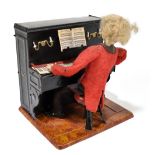 FERNAND MARTIN; an early 20th century French tinplate clockwork musical figure of a gentleman