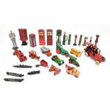 A small collection of diecast toys including a J O Hill & Co fire engine, ladder and six firemen,