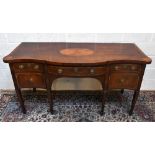 A George III inlaid mahogany serpentine sideboard, with a central drawer flanked by a cupboard