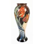 SALLY TUFFIN FOR MOORCROFT; an inverted baluster vase decorated in the 'Red Tulip' pattern, height