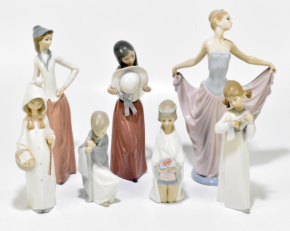 LLADRO; five figures including a dancing girl wearing a tiara and flowing dress, height 32cm, also a