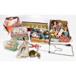 A collection of vintage dolls and games, mostly celluloid, to include a Happy Character doll by