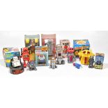 A collection of eleven battery operated and other tinplate and plastic robot toys, including a 'Mr