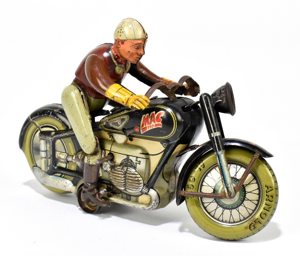 ARNOLD; a MAC 700 German tinplate clockwork motorcycle and rider, length 19cm. PROVENANCE: The