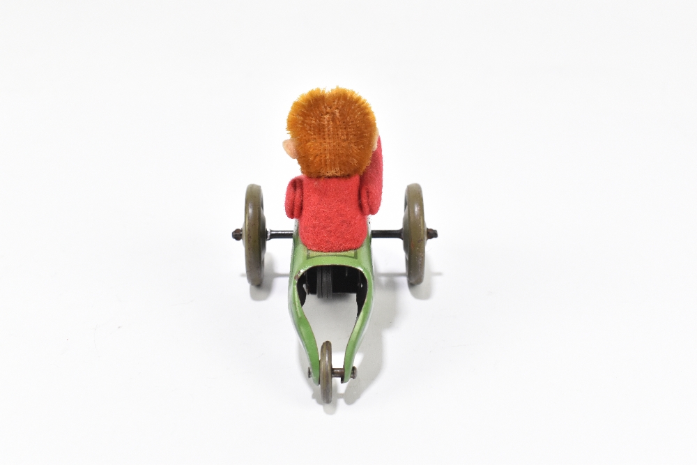 SCHUCO; a tinplate friction model of a three wheel motorcar with monkey driver, length 9cm. - Bild 3 aus 5