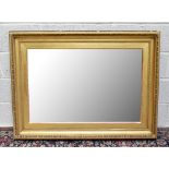 A 19th century gilt picture frame converted to wall mirror, with bevelled edged plate, width