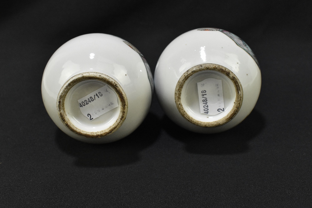 A pair of late 19th century Chinese porcelain bulbous vases with flared necks, each decorated with - Image 6 of 6