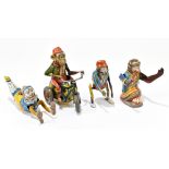 Four German tinplate clockwork toys, three modelled as monkeys and one as a clown, comprising a