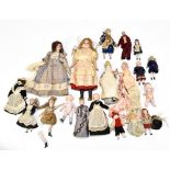 A collection of nineteen late 19th century and later bisque miniature dolls and dolls house dolls,