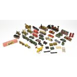 A collection of vintage tinplate model cars, trains, houses, etc, including a tractor, a no.575