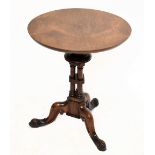 A rosewood occasional table on column tripod supports, height 60cm, diameter 51cm.