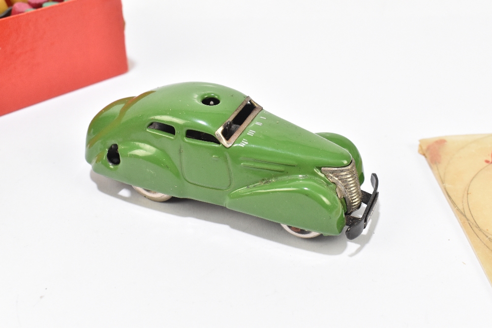 SCHUCO; a boxed tinplate clockwork telesteering car with ball pegs, ball, steering wheel, key and - Image 2 of 4