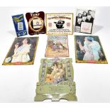 ADVERTISING; a collection of seven vintage advertising easel and hanging shop signs, comprising