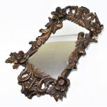 A 19th century gilt wood and gesso wall mirror, with scroll and flower frame, height 76cm, width