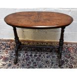 A Victorian inlaid walnut oval occasional table on turned stretchered supports, 91 x 52.5cm.