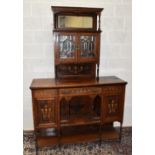 An Edwardian rosewood chiffonier, with reduced top above a drawer, two cupboard doors and undertier,