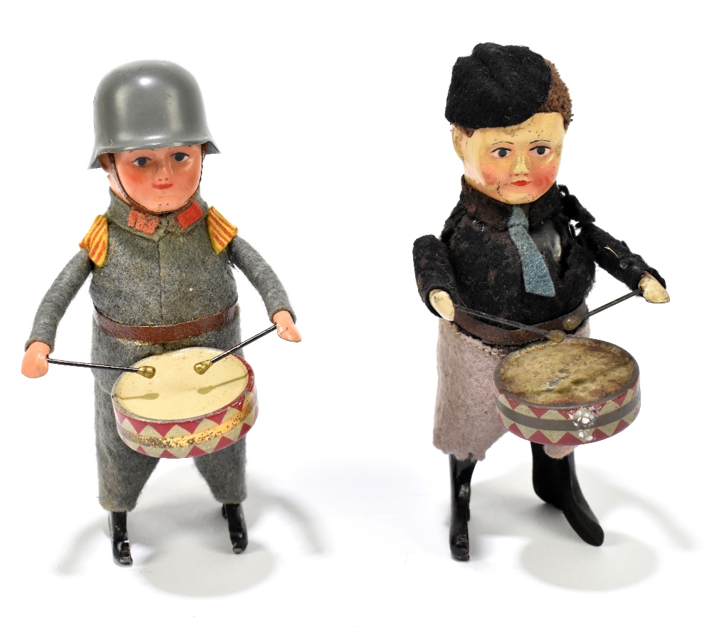 SCHUCO; two clockwork figures of boys, one in a military uniform, the other with a different