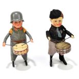 SCHUCO; two clockwork figures of boys, one in a military uniform, the other with a different