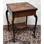 An Edwardian rosewood envelope card table, with ivory inalid floral and scrolling detail, drawer, on