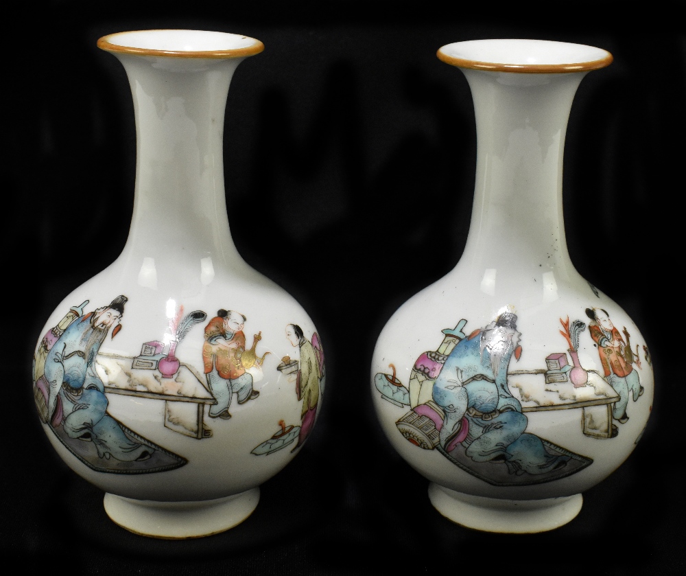 A pair of late 19th century Chinese porcelain bulbous vases with flared necks, each decorated with