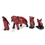 ROYAL DOULTON; four flambé animal figures comprising elephant, penguin, cat and fox (4).Additional