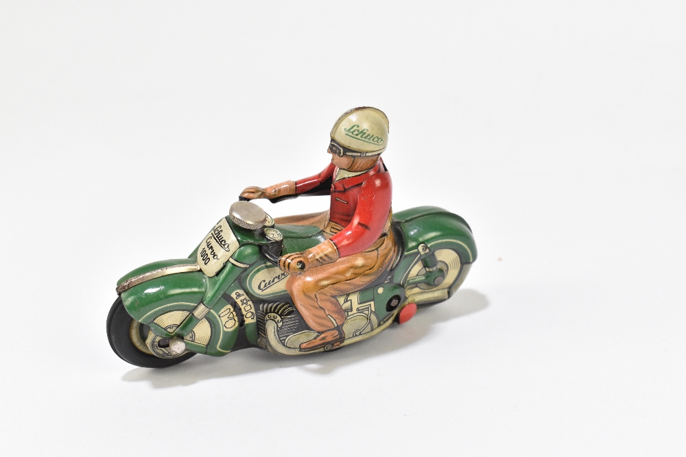 SCHUCO; a German tinplate clockwork Curvo 1000 motorcycle, with rider, length 12cm. PROVENANCE: - Bild 2 aus 4