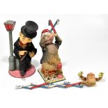 Two Japanese battery operated toys comprising a tinplate clown with monkey and bulb nose, and a