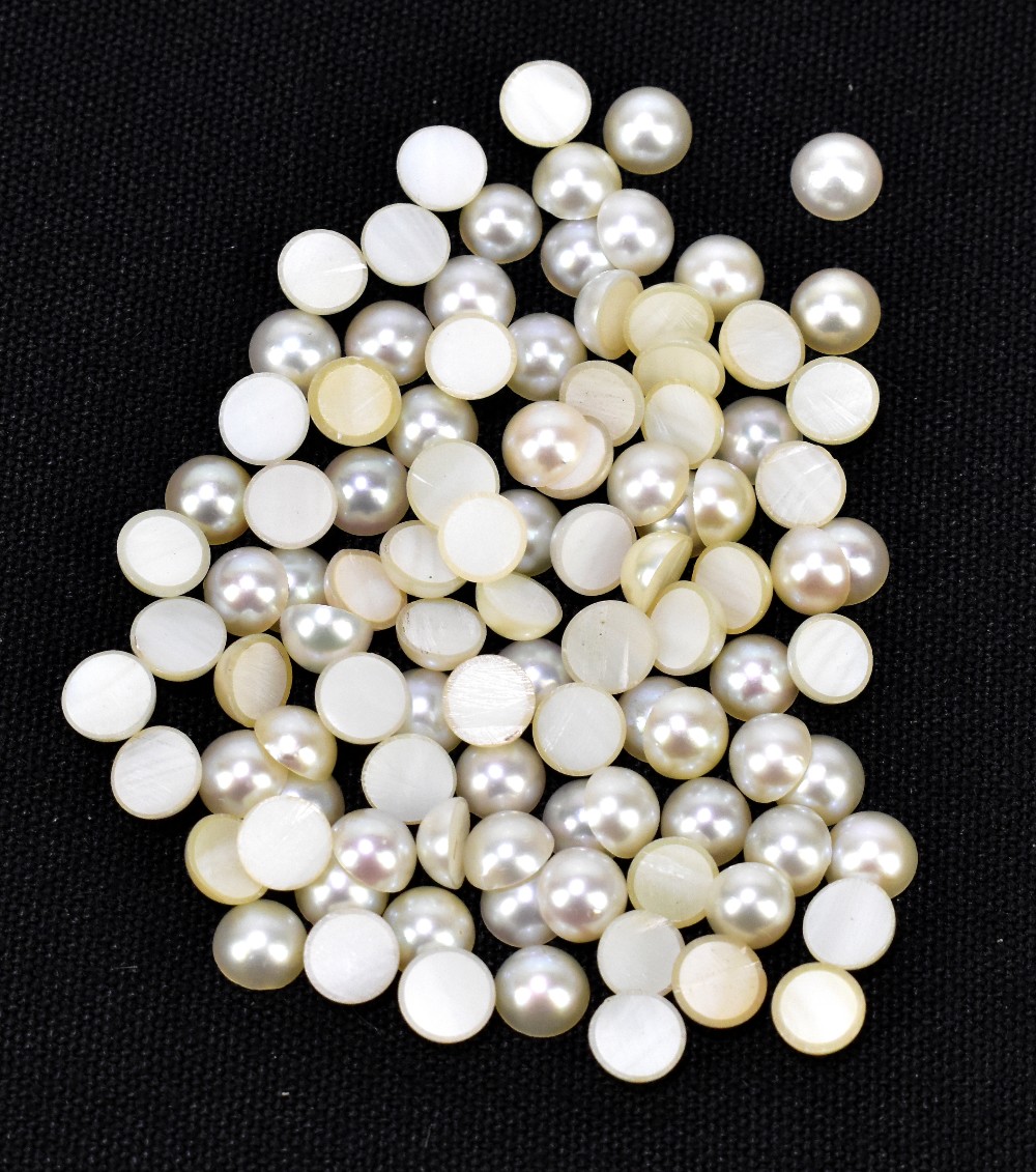 CULTURED JAPANESE PEARLS; a group of one hundred 5.75mm diameter round cabochons.