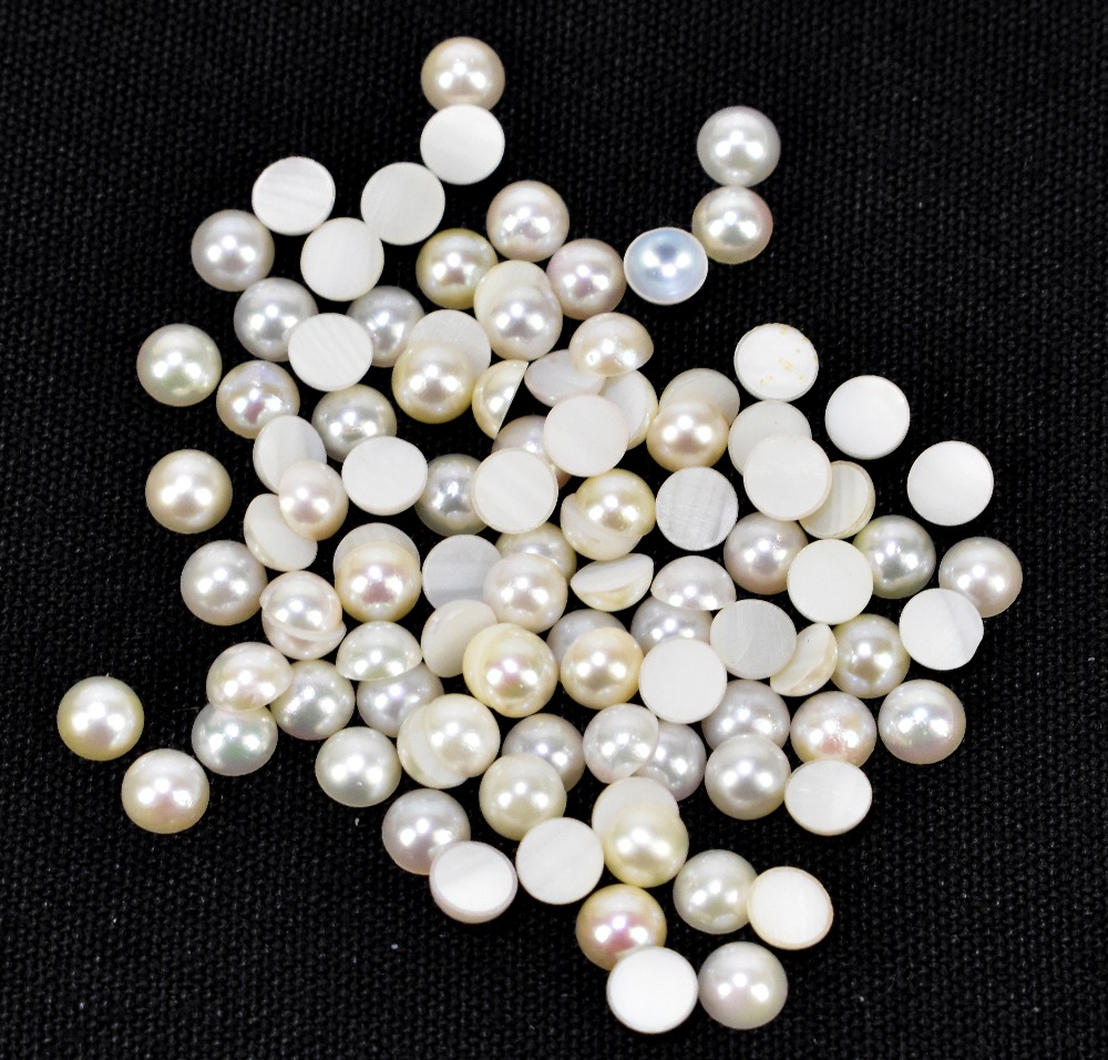 CULTURED JAPANESE PEARLS; a group of one hundred 5mm diameter round cabochons.