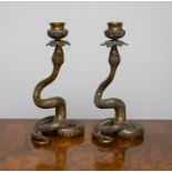 Pair of brass serpent candle holders. 11cm.