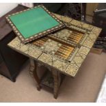 Moorish. Folding gaming table which reveals chess, backgammon and card table. Fine detailed
