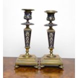 Pair of brass candle holders with enamel design. (2)