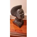 African. A carved stone head of a female. Signed. see image.
