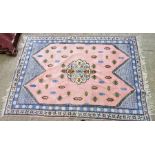 Large rug. Pink and blue. Approx 240 x 180cm.