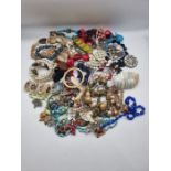 Quantity of new and vintage costume jewellery, including shell bracelets.