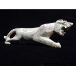Chinese Pink Marble Stylistic carving of Tiger. 20th century. Art Deco style. Modelled prowling on