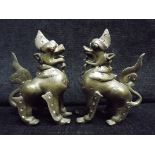 Pair of Chinese / Sino Tibetan - Gilt Bronze Mythical Beast. Glass or Stone Eyes and decoration.