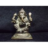 Hindu Ganesha Small Gilt Bronze Figure. His four arms holding an elephant goad (ankusha), a noose (
