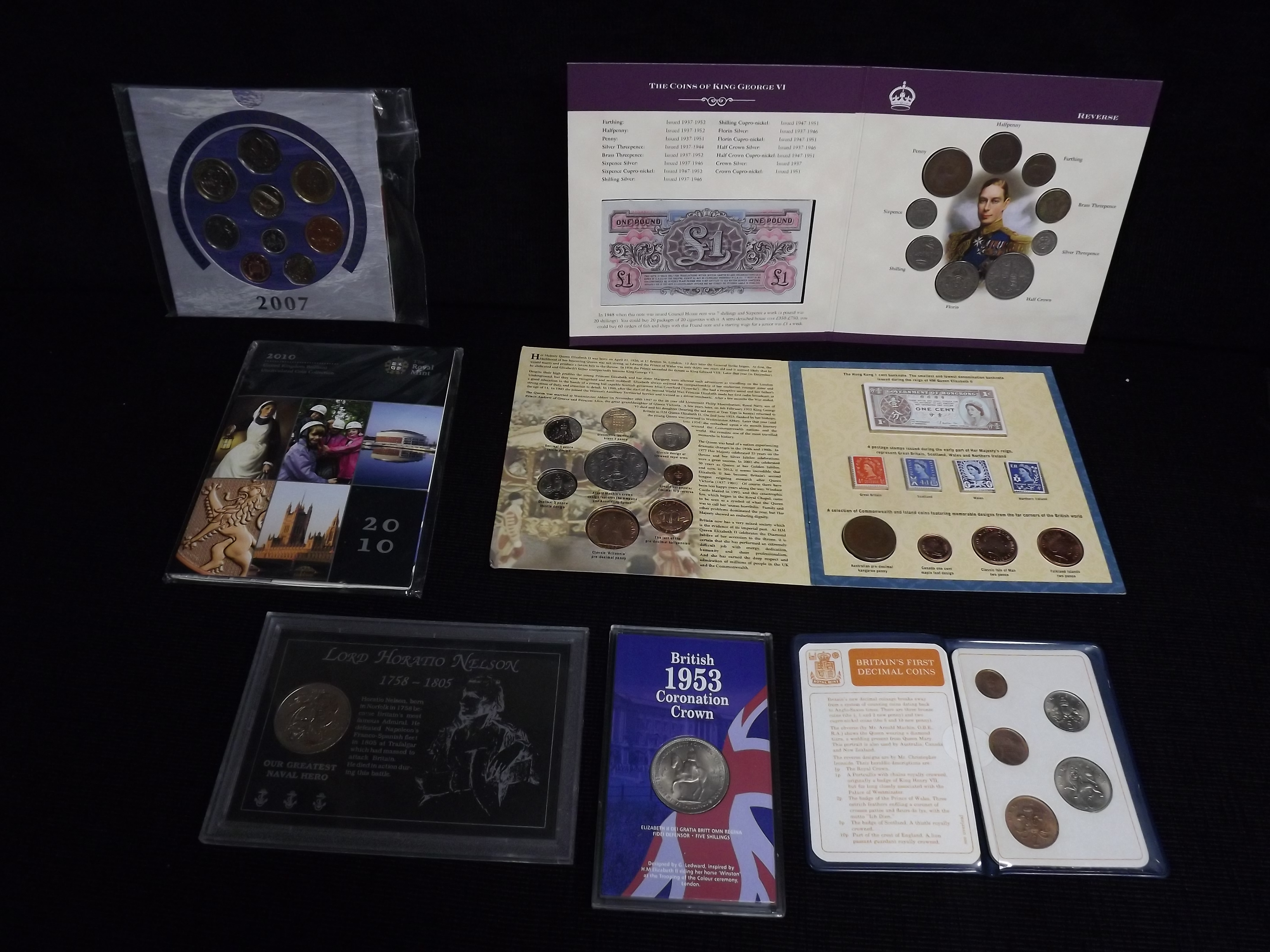 7 x Coin Sets. 1937-1952 King George VI Coronation with Stamp and Forces Note, Lord Horatio Nelson