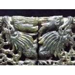 A Pair of Chinese Spinach Green Soapstone Book Ends. Carved with opposing Dragons emerging from